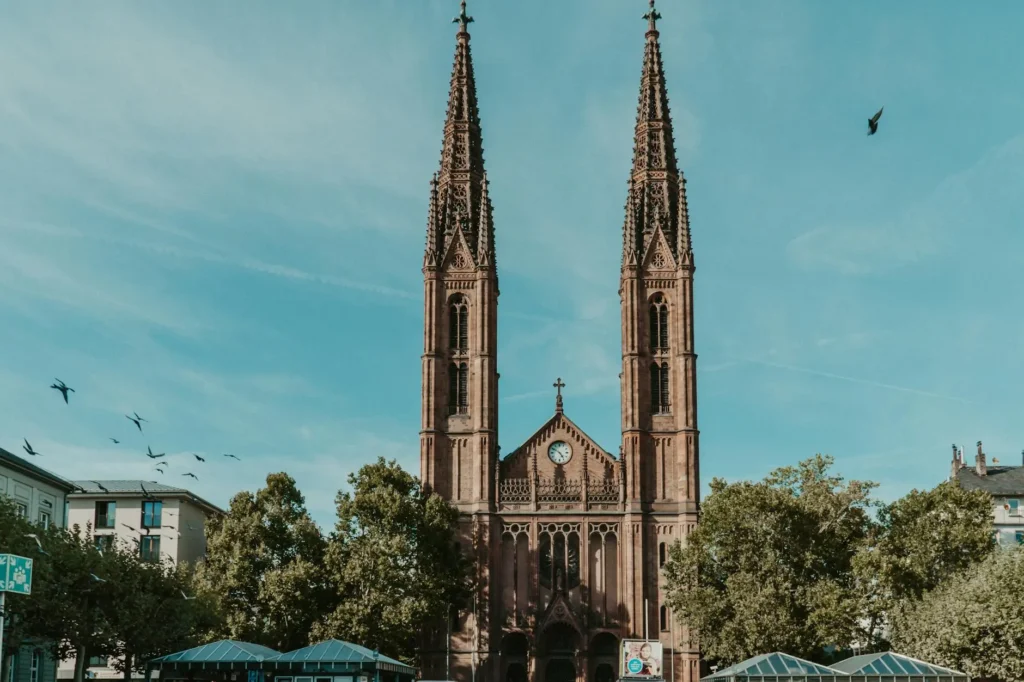 Stunning view of St. Bonifatius Church with gothic architecture and blue sky in Wiesbaden.