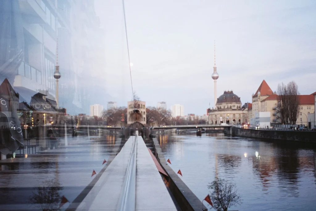 Beautiful view of Berlin's Spree River with reflections of Fernsehturm at twilight.