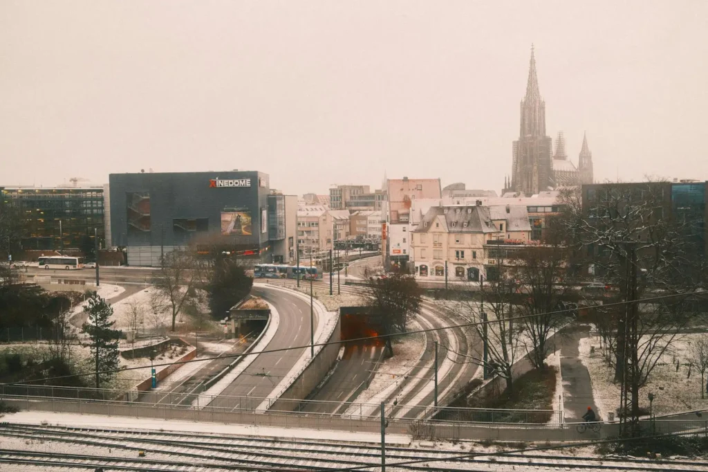 Snowy urban landscape of Ulm featuring Ulm Minster in winter.